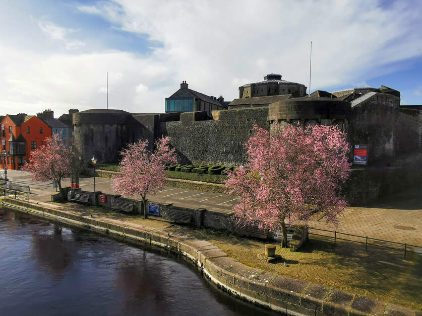 Outer wall of Athlone Castle with the River Shannon flowing infront